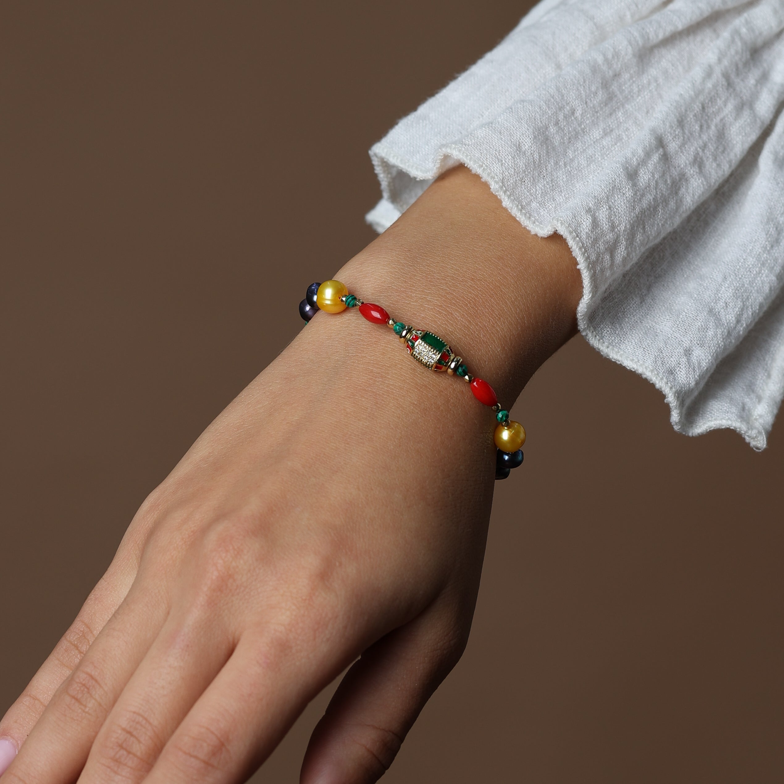PEARL BRACELET - FEATURING CORAL , MALACHITE AND HEMATITE