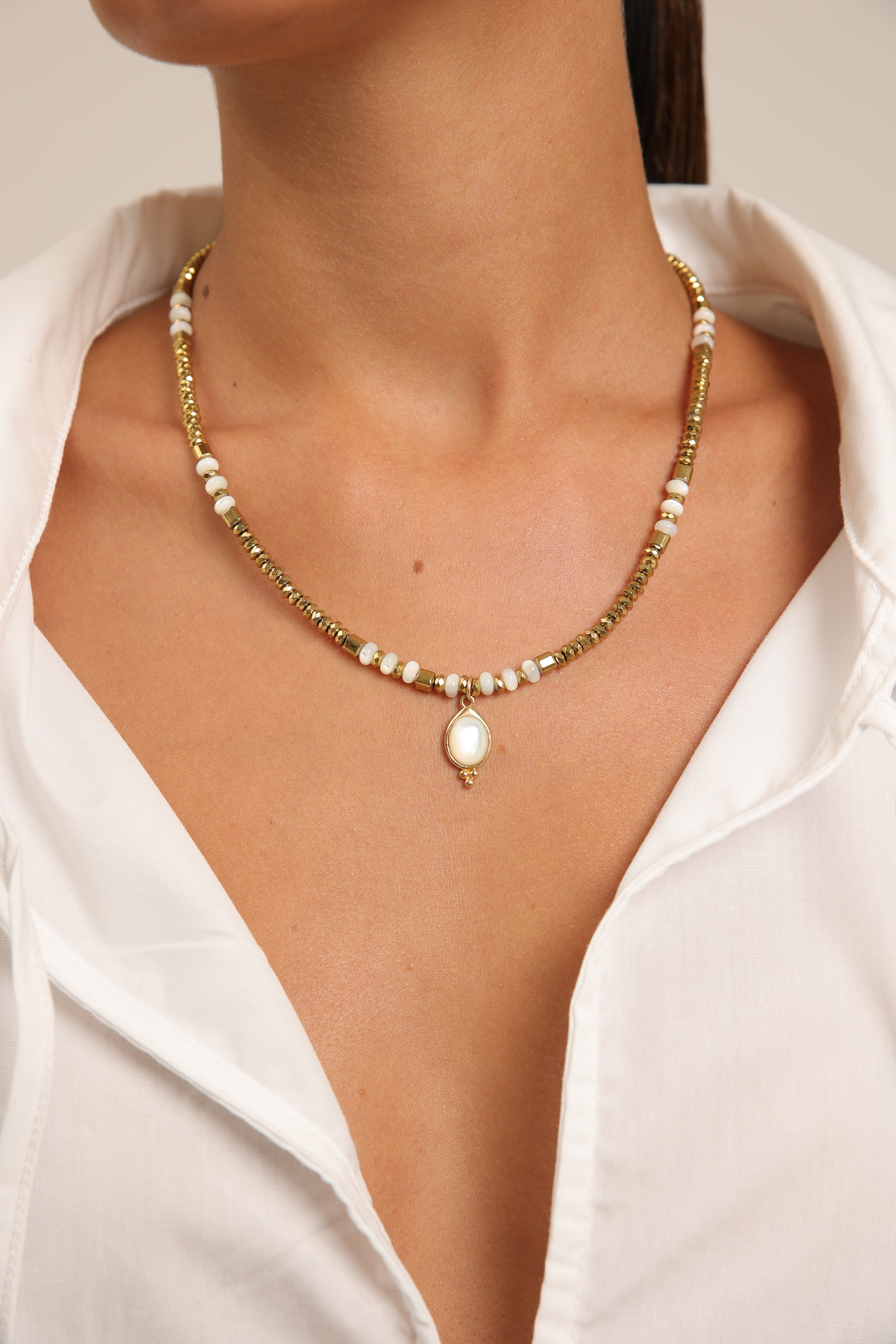 Hematite Necklace with Mother of Pearl Gold Pendant