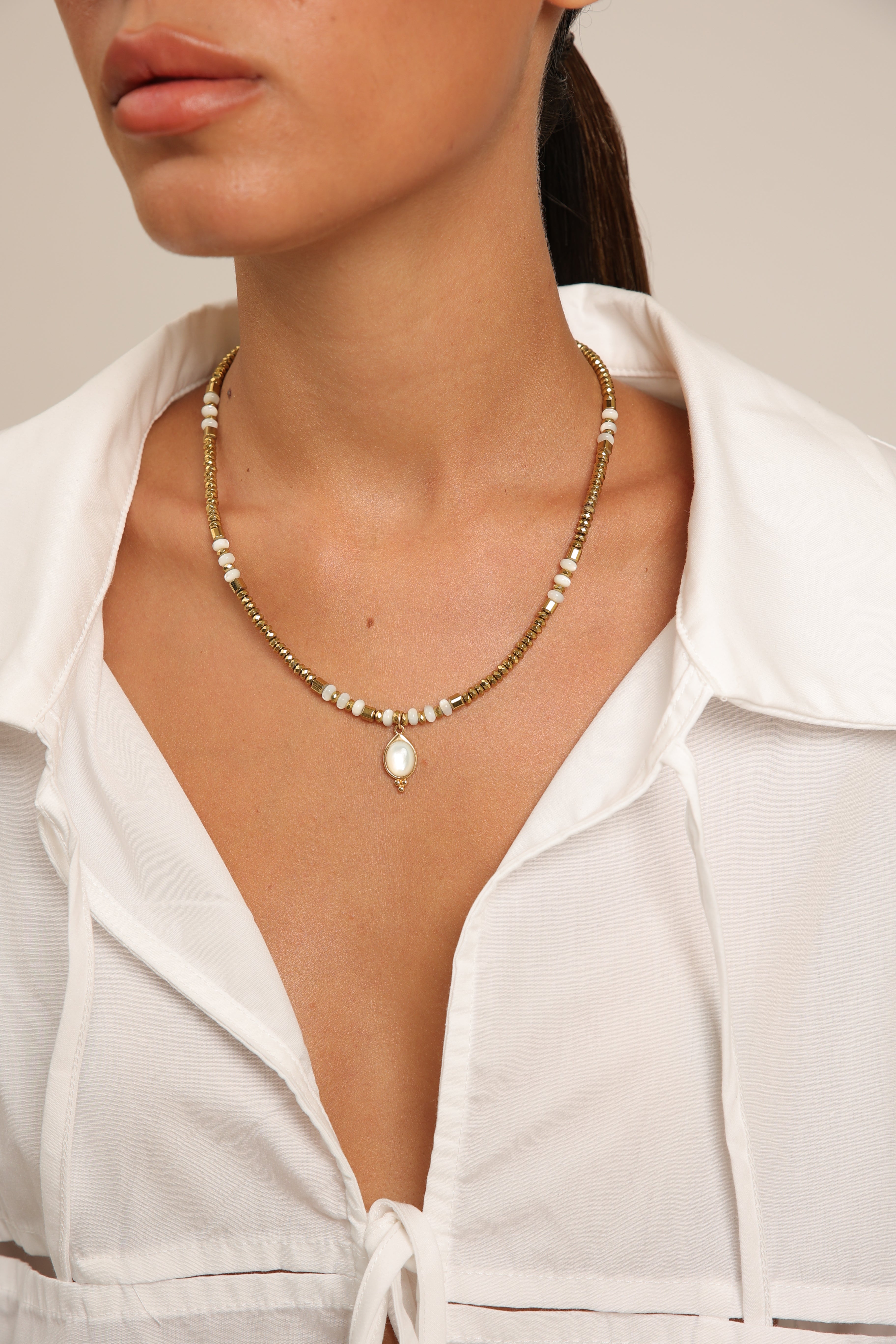 Hematite Necklace with Mother of Pearl Gold Pendant